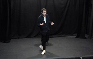 A man standing on a stage and performing