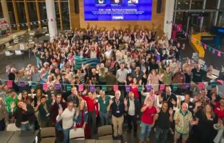 A crowd of people waving