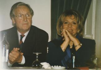 The celebrities Nicholas Parsons and Esther Rantzen sitting at a table
