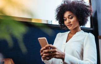 A woman looking at her smartphone
