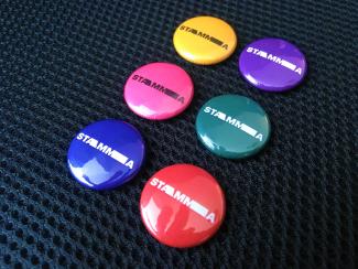 Six colourful badges