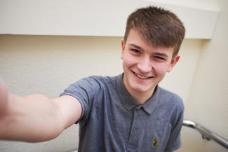 A young man smiling