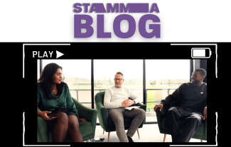 A woman and two men sitting on armchairs and chatting, with viewfinder graphics overlaid