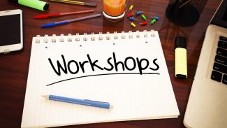 A writing pad with the word 'Workshop' on it