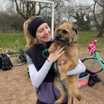 A woman holding a dog