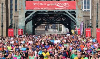 A sponsored run scene, with a crowd of runners