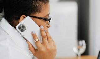 A woman speaking into a mobile phone