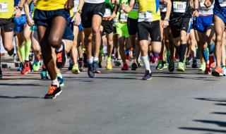 Legs of a group of people on a sponsored run