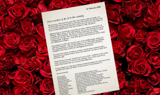 A typed letter with a background of roses