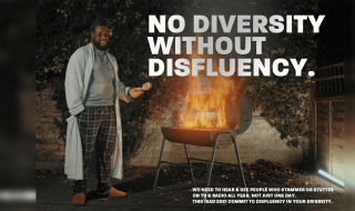 A man standing next to a barbecue that has flames coming out of it.