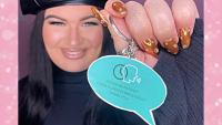 A young woman smiling and holding up a speech bubble-shaped keyring with 'Please be patient, I have a speech impediment. Thank you!'