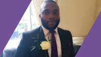 A man in a wedding suit smiling