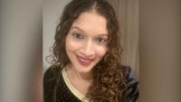 A woman smiling