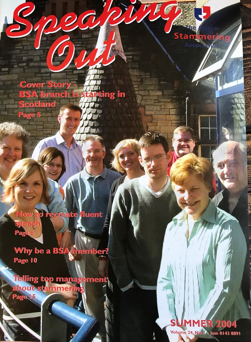 The cover of a magazine featuring a group of people looking at the camera