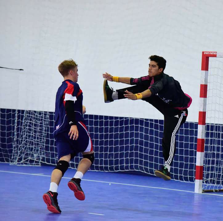 Two boys playing handball