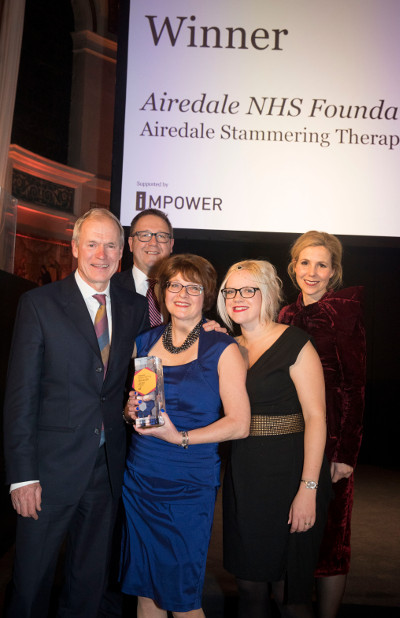 Stephanie and team winning a Guardian Public Service award