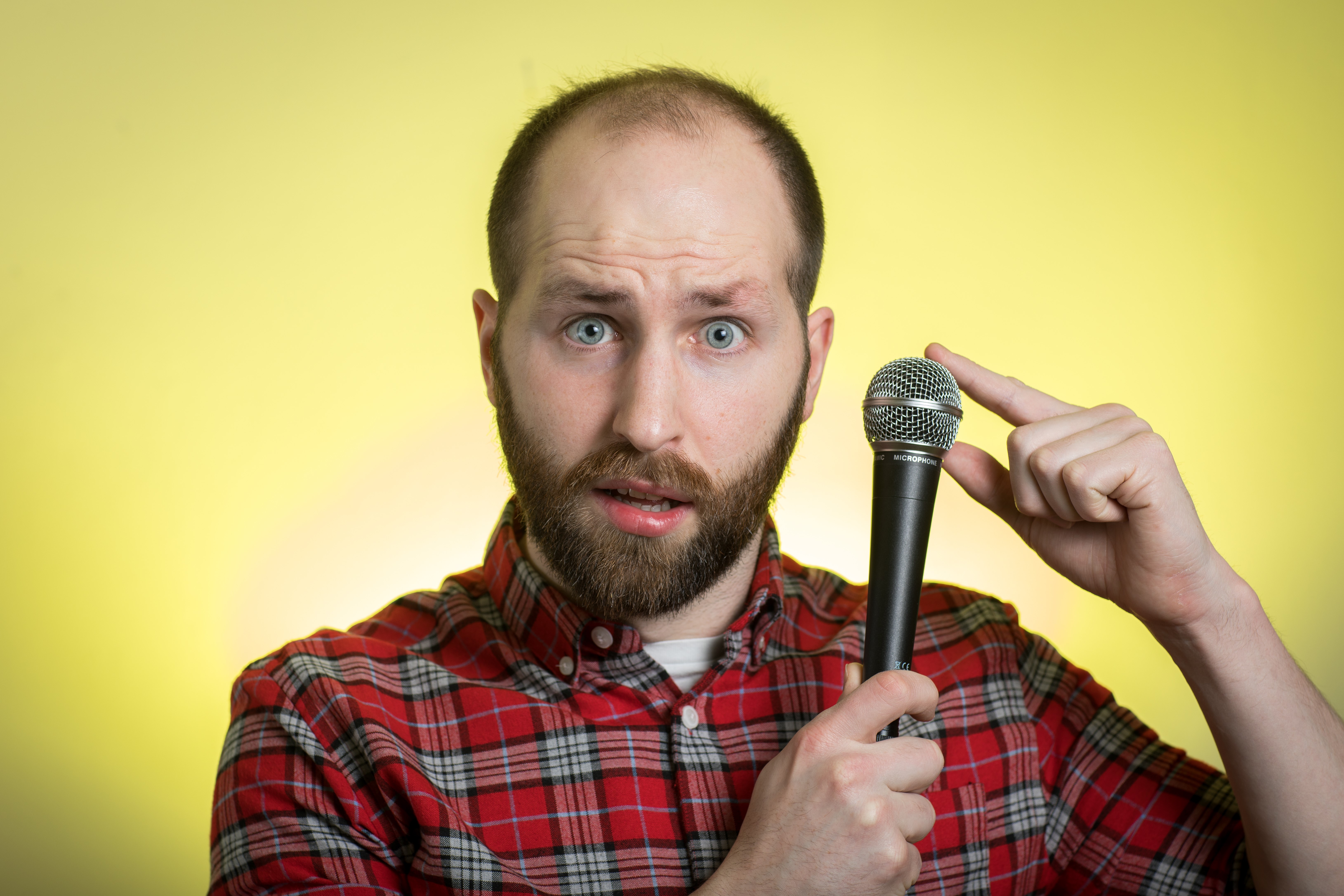 The author Aidan Green with a microphone