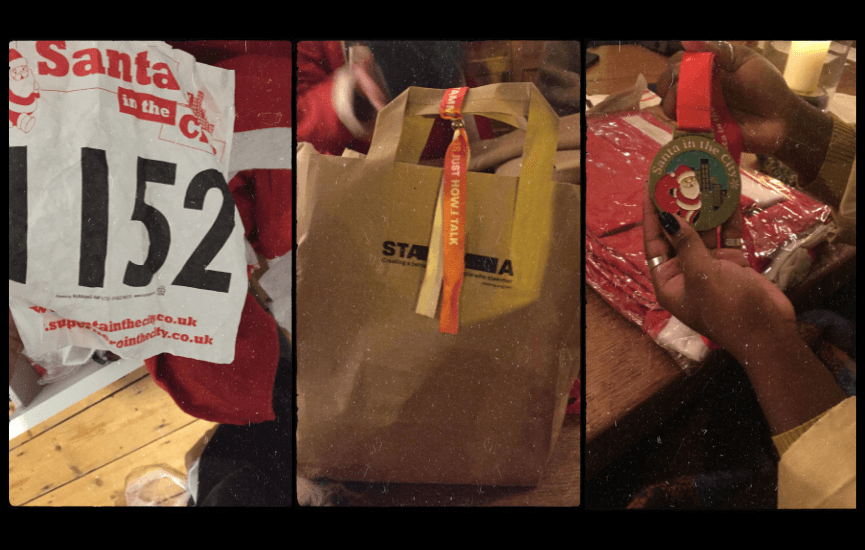 A number from a running event, a brown paper bag with STAMMA on it, and a hand holding a medal
